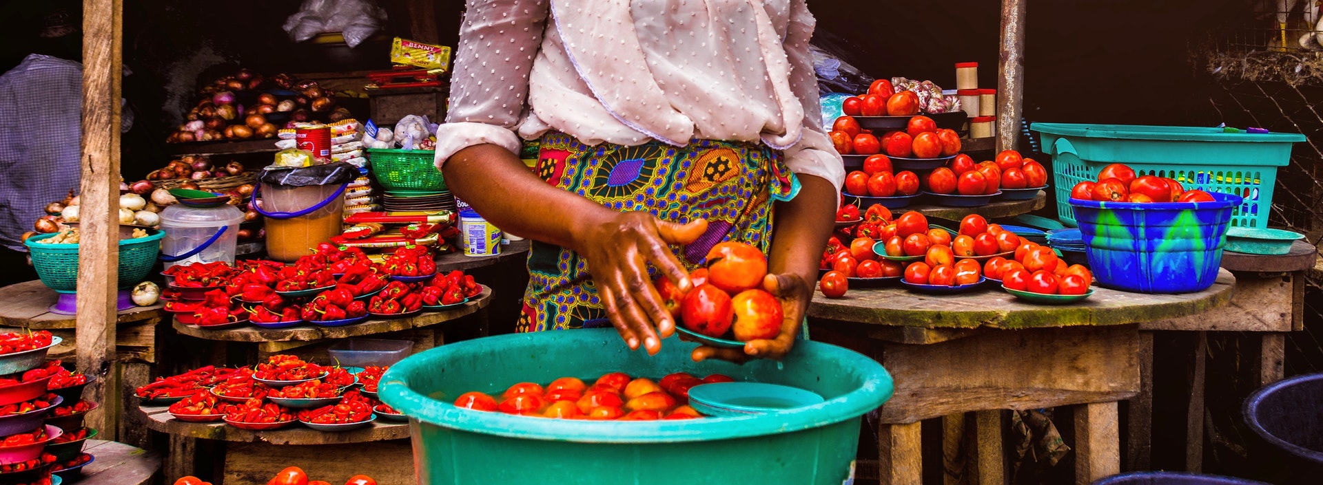 Woman selling vegetables in a local market